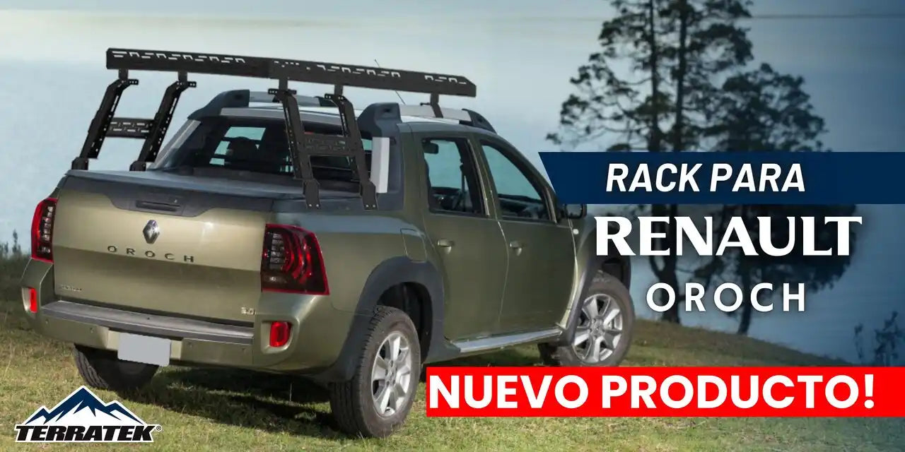 Una camioneta pickup verde de cuatro puertas con un sistema de portaequipajes negro en el techo.